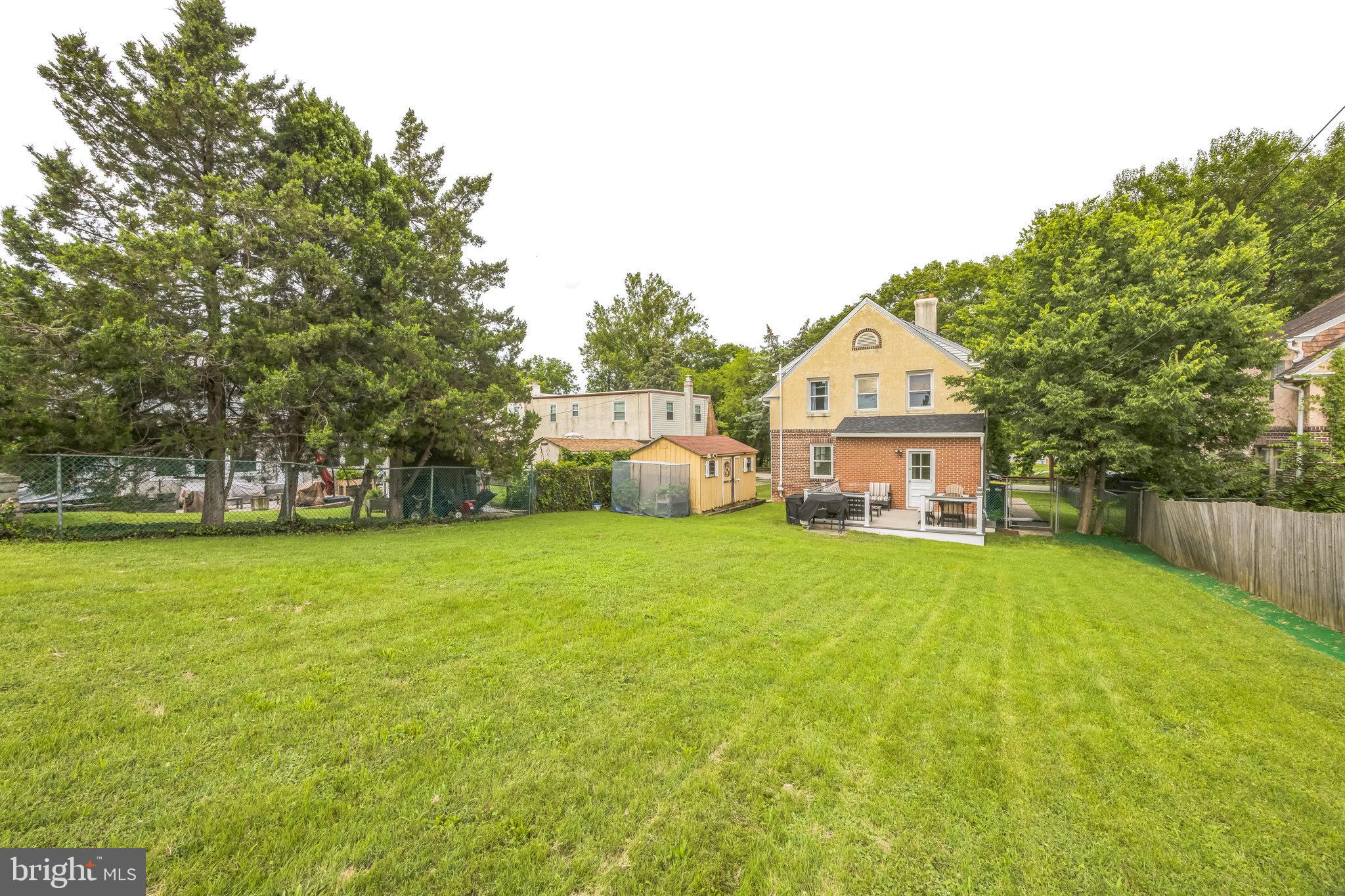 665 U Street King of Prussia, PA 19406 - Photo 25 of 26 a front view of a house with a garden and trees