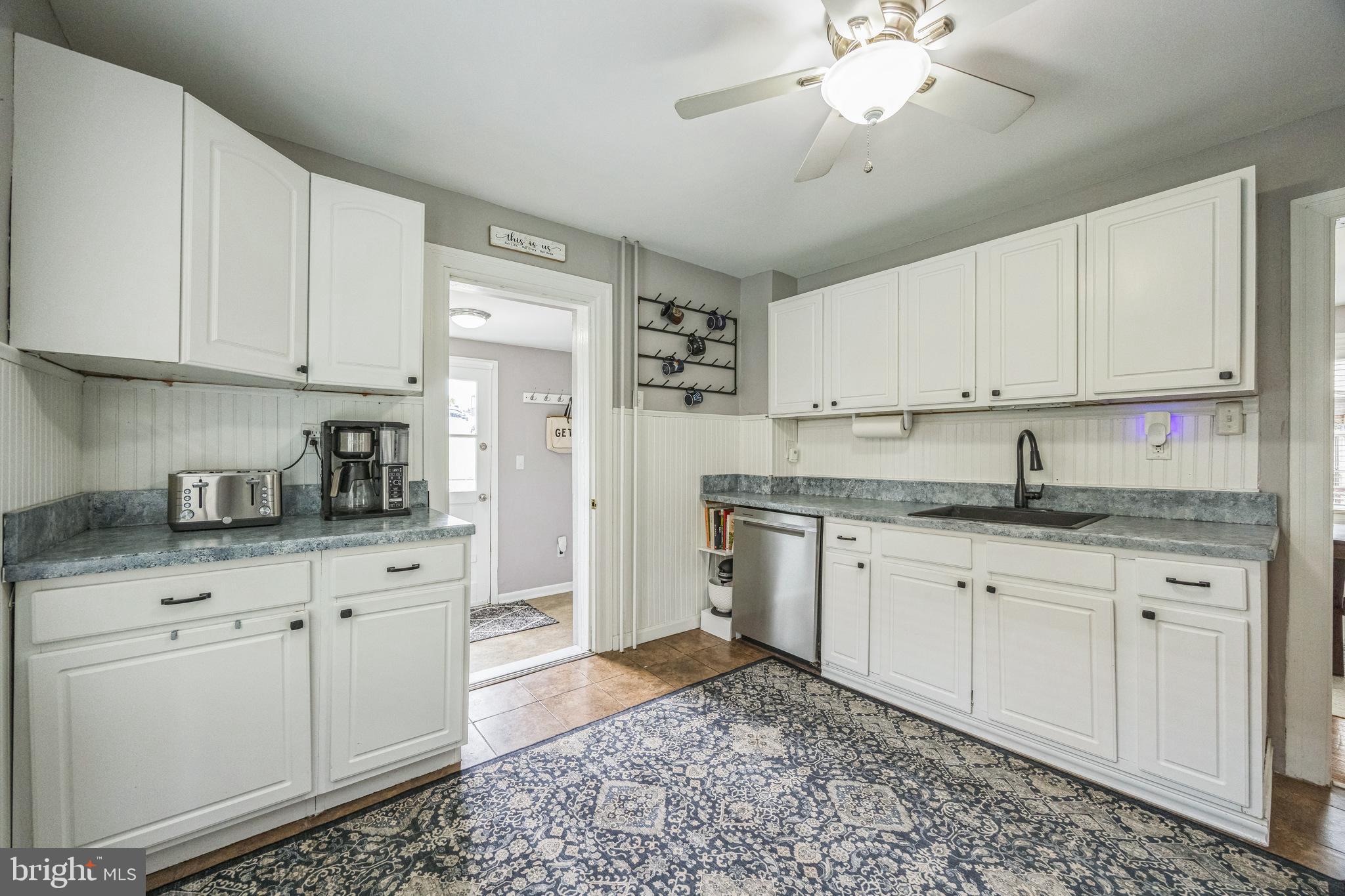 665 U Street King of Prussia, PA 19406 - Photo 10 of 26 a kitchen with granite countertop white cabinets white stainless steel appliances and a sink