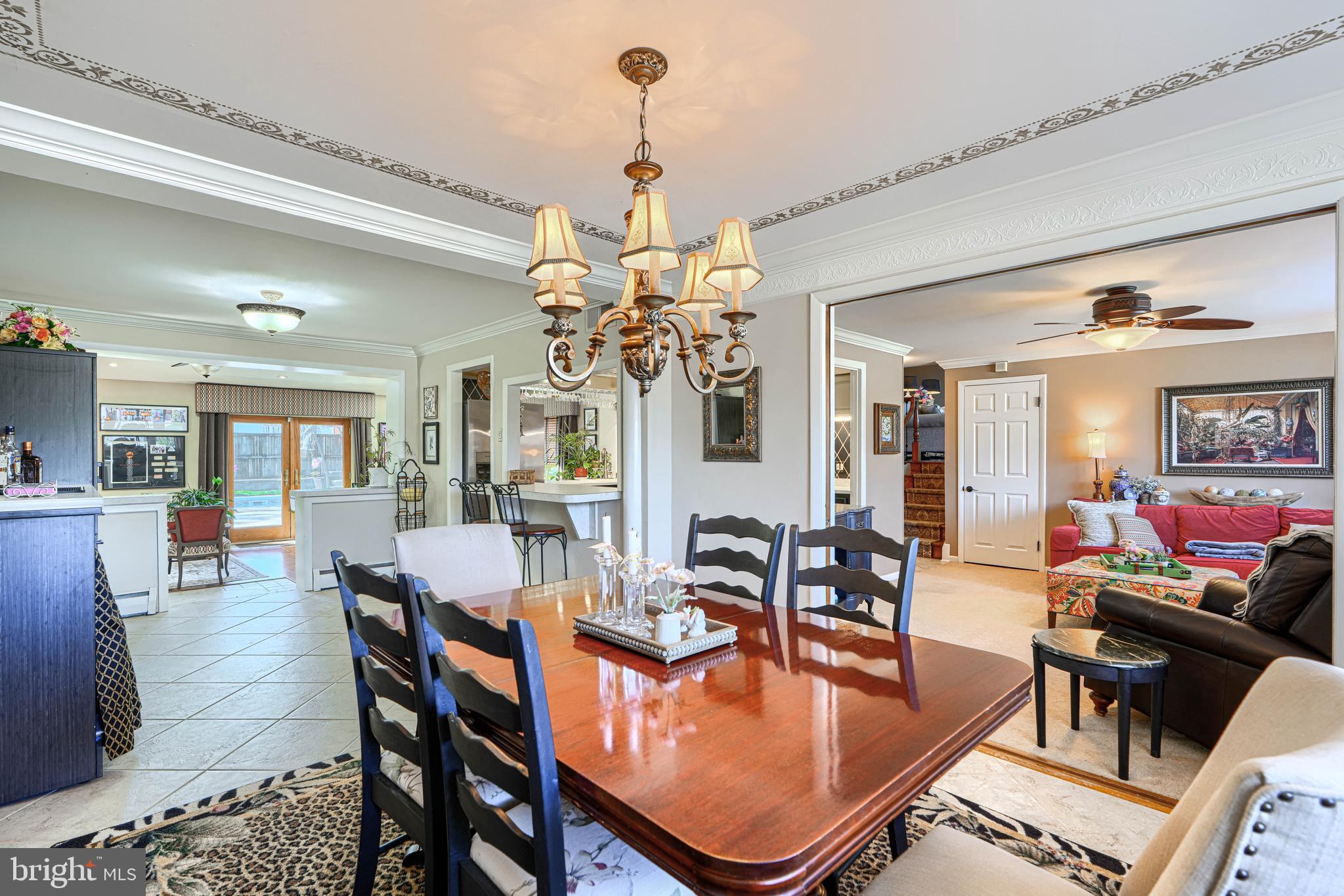 2118 Eastridge Road Lutherville-Timonium, MD 21093 - Photo 11 of 49 a dining room with furniture a chandelier and wooden floor