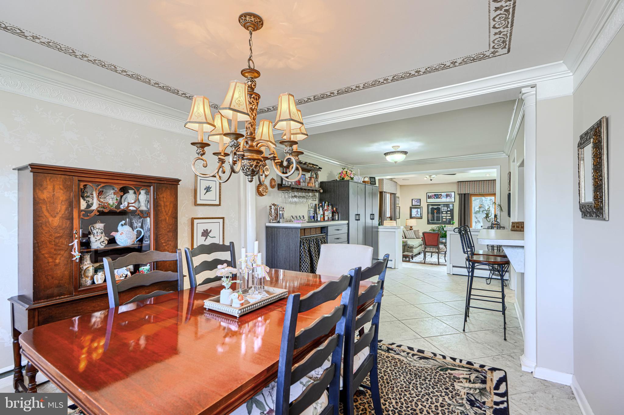 2118 Eastridge Road Lutherville-Timonium, MD 21093 - Photo 12 of 49 a dining room with furniture a chandelier and fireplace