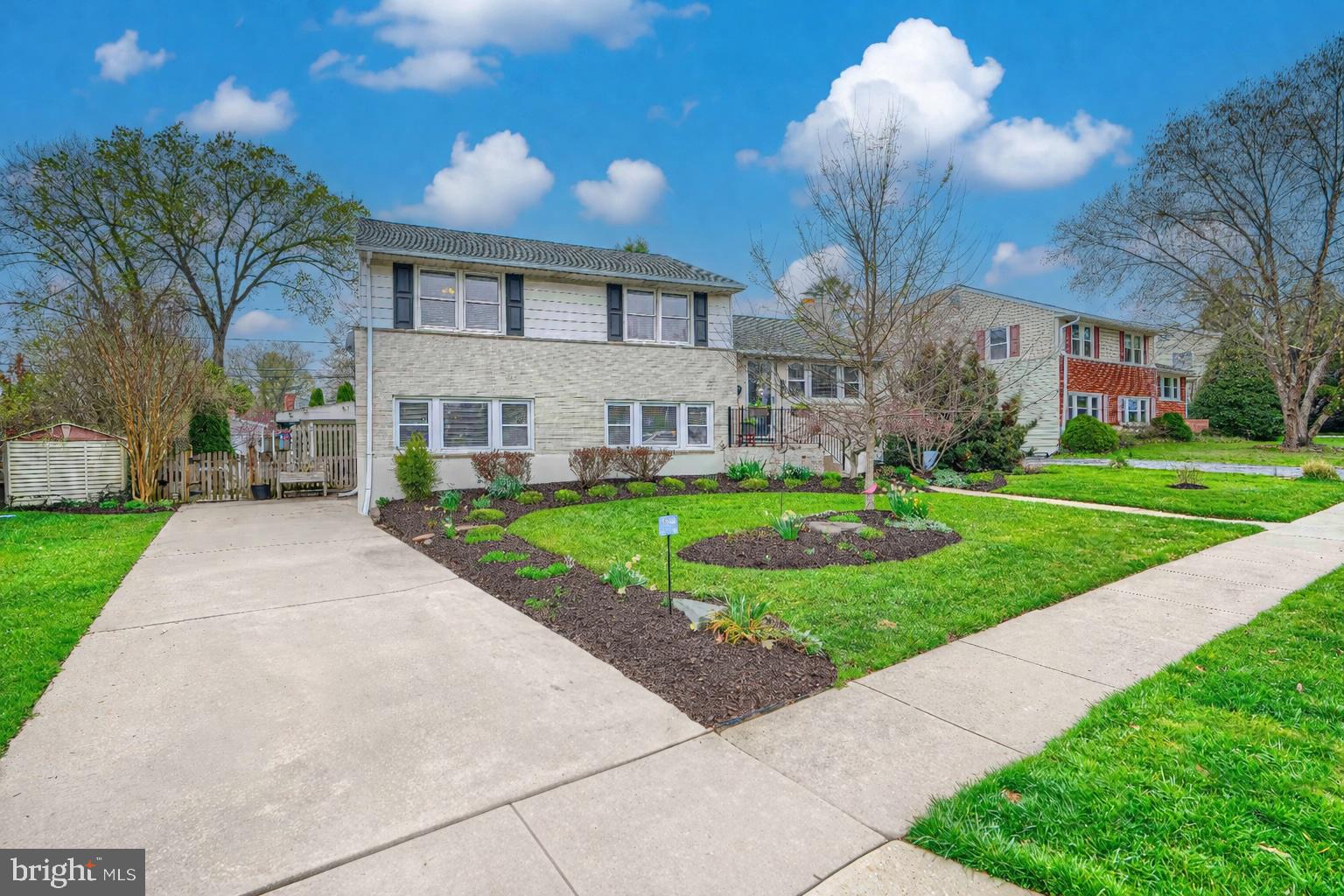 2118 Eastridge Road Lutherville-Timonium, MD 21093 - Photo 2 of 49 a view of a white house with a big yard and large trees