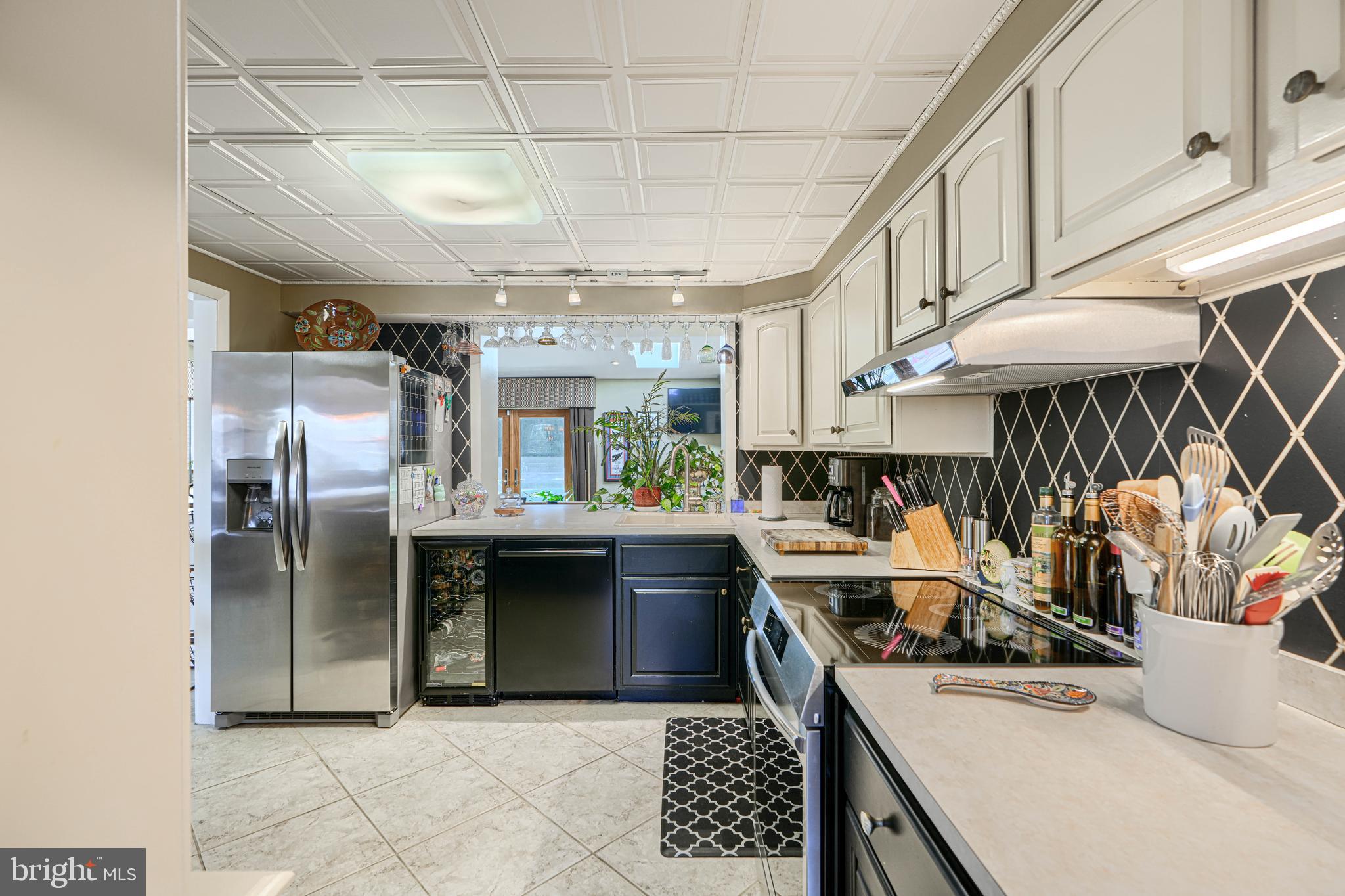 2118 Eastridge Road Lutherville-Timonium, MD 21093 - Photo 23 of 49 a kitchen with stainless steel appliances granite countertop a sink and cabinets