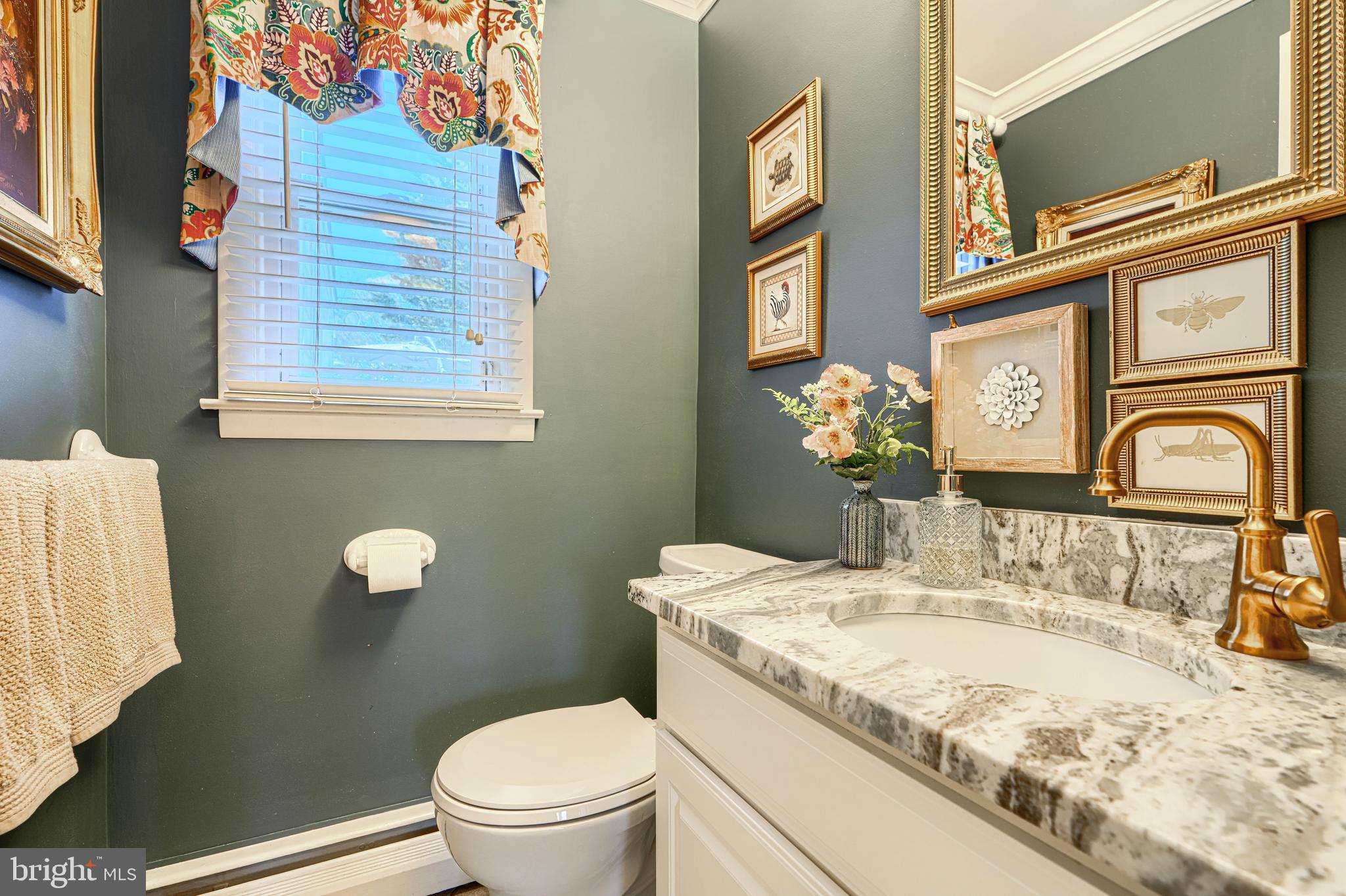 2118 Eastridge Road Lutherville-Timonium, MD 21093 - Photo 24 of 49 a bathroom with a granite countertop toilet sink and mirror