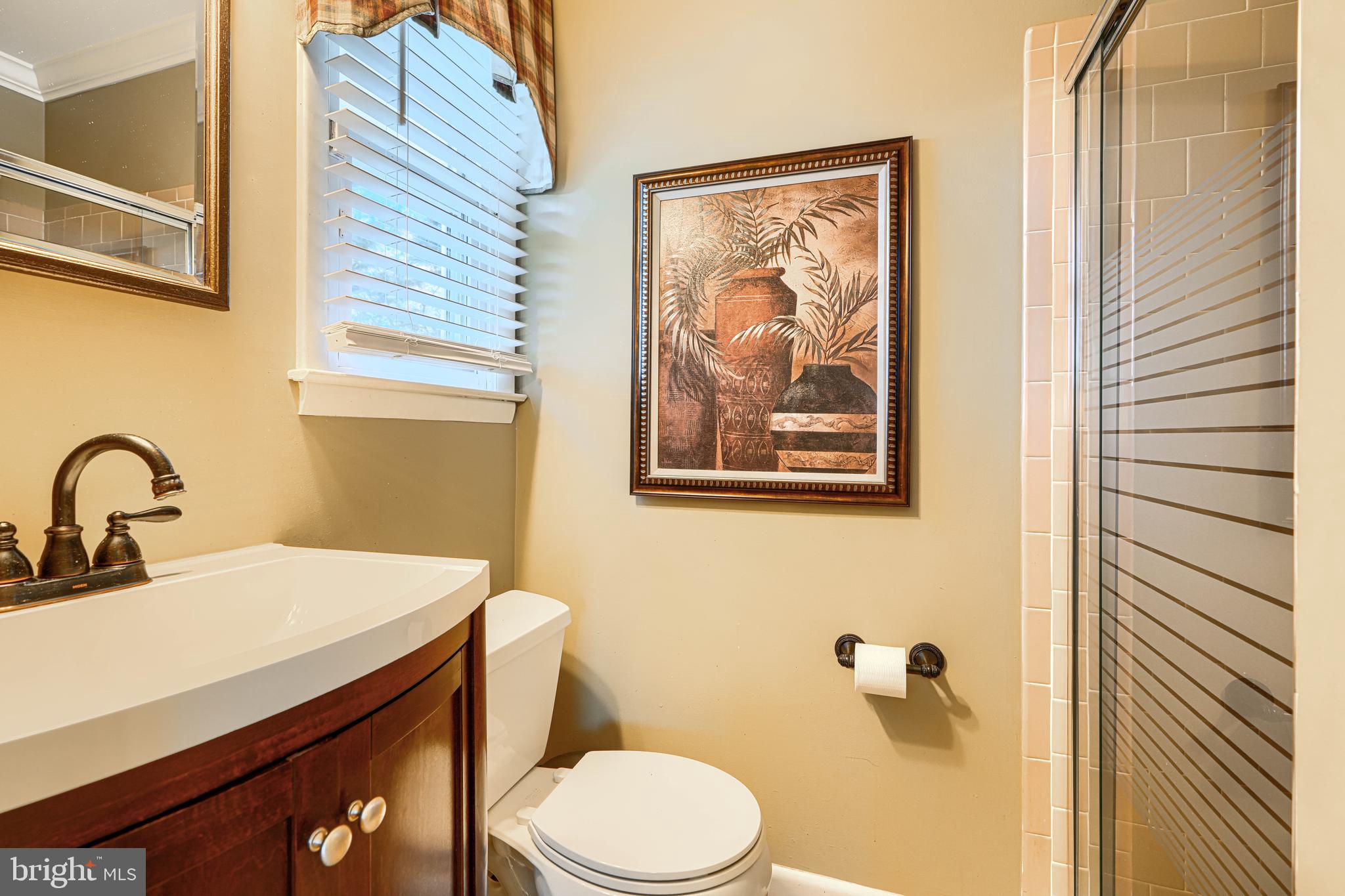 2118 Eastridge Road Lutherville-Timonium, MD 21093 - Photo 28 of 49 a bathroom with a toilet a sink and mirror