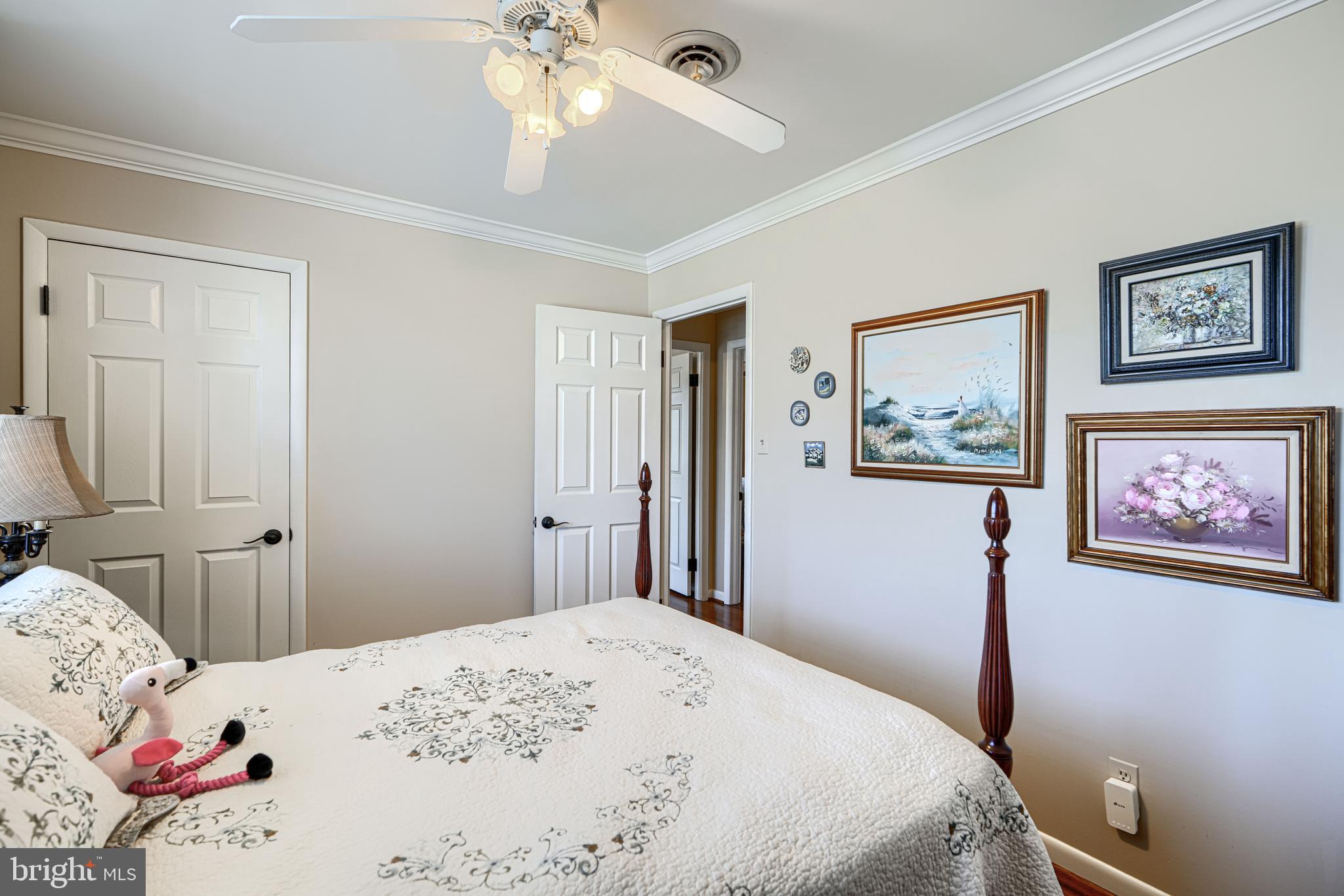 2118 Eastridge Road Lutherville-Timonium, MD 21093 - Photo 31 of 49 a bedroom with a large bed and a chandelier