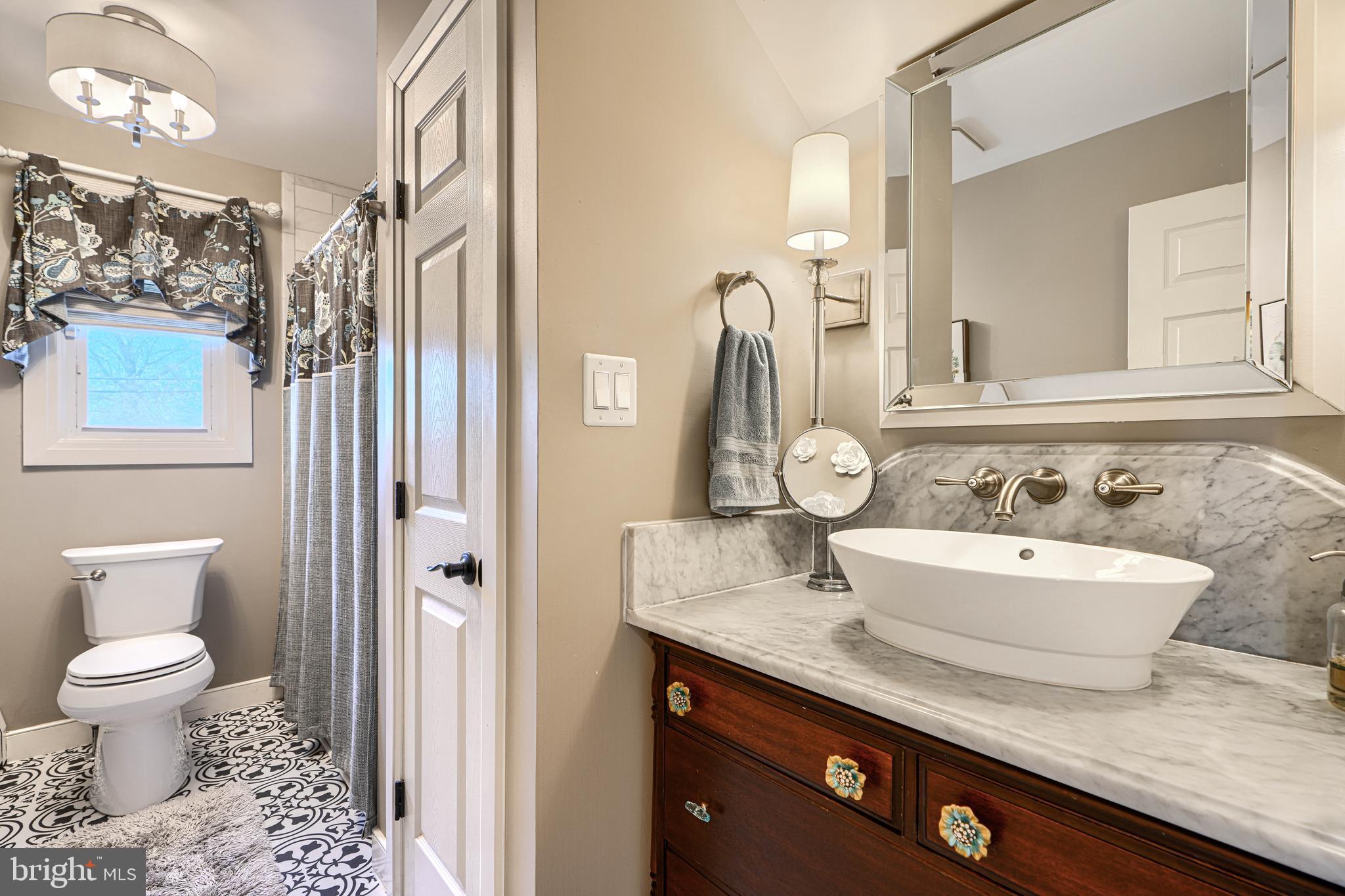 2118 Eastridge Road Lutherville-Timonium, MD 21093 - Photo 34 of 49 a bathroom with a granite countertop sink and a mirror