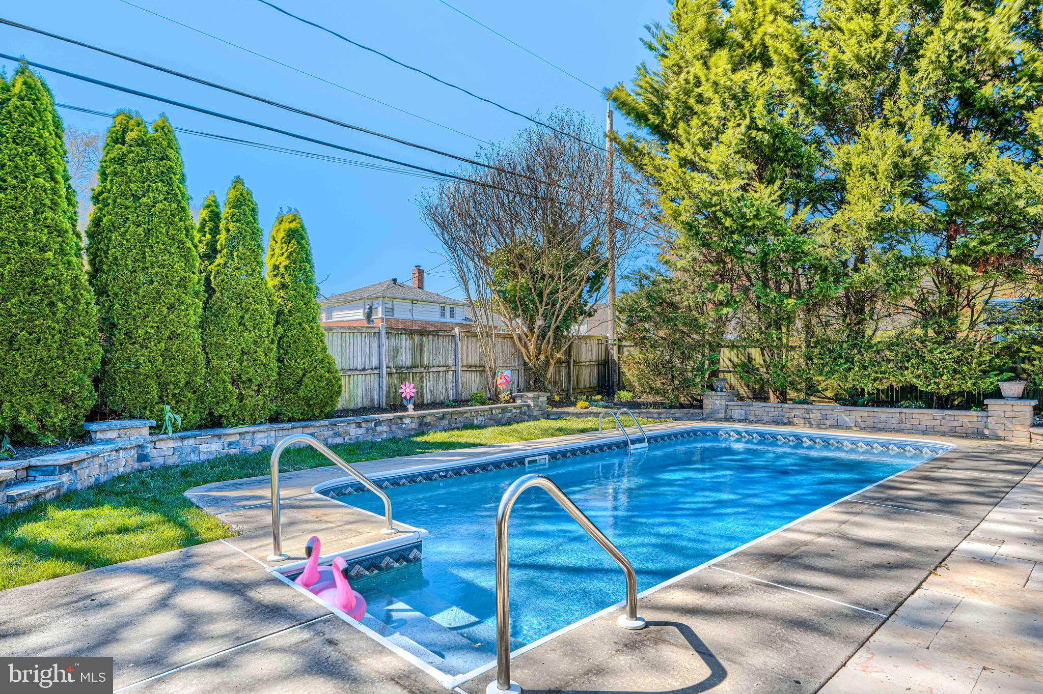 2118 Eastridge Road Lutherville-Timonium, MD 21093 - Photo 38 of 49 a view of pool with lawn chairs and plants