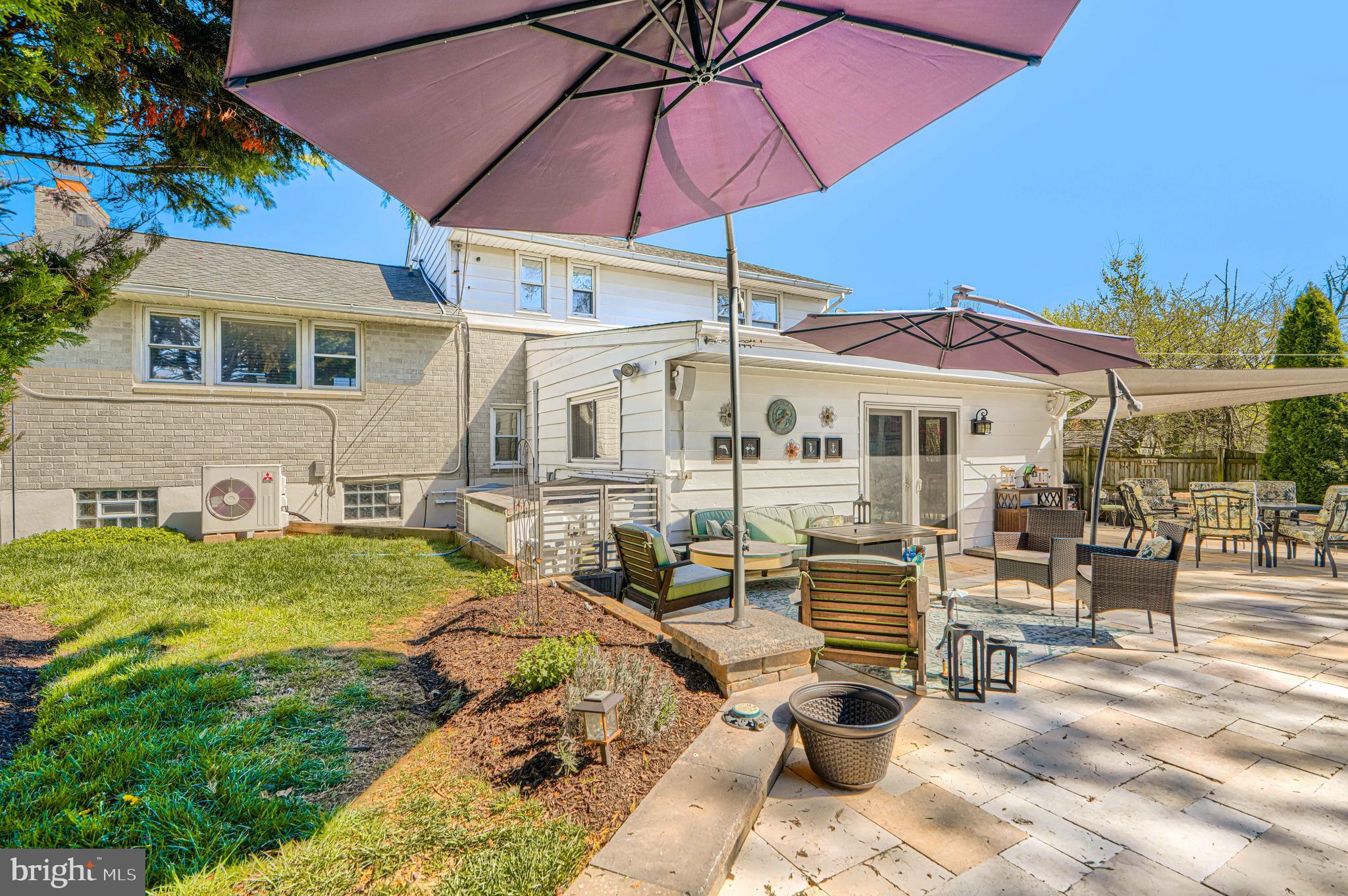 2118 Eastridge Road Lutherville-Timonium, MD 21093 - Photo 48 of 49 a view of a patio with chairs and table under an umbrella