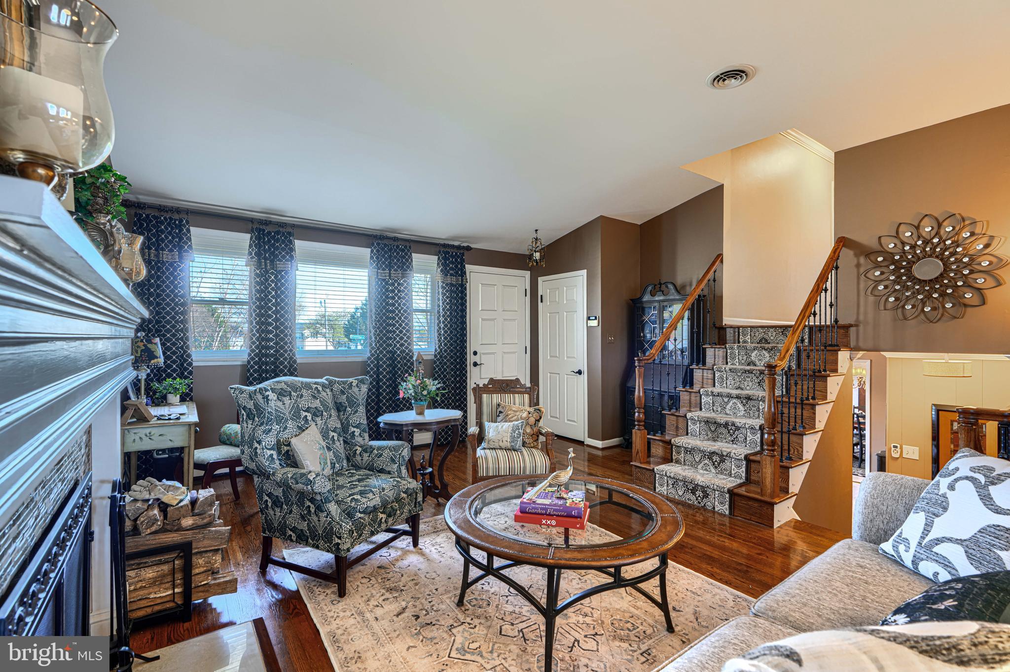2118 Eastridge Road Lutherville-Timonium, MD 21093 - Photo 6 of 49 a living room with furniture and a fireplace
