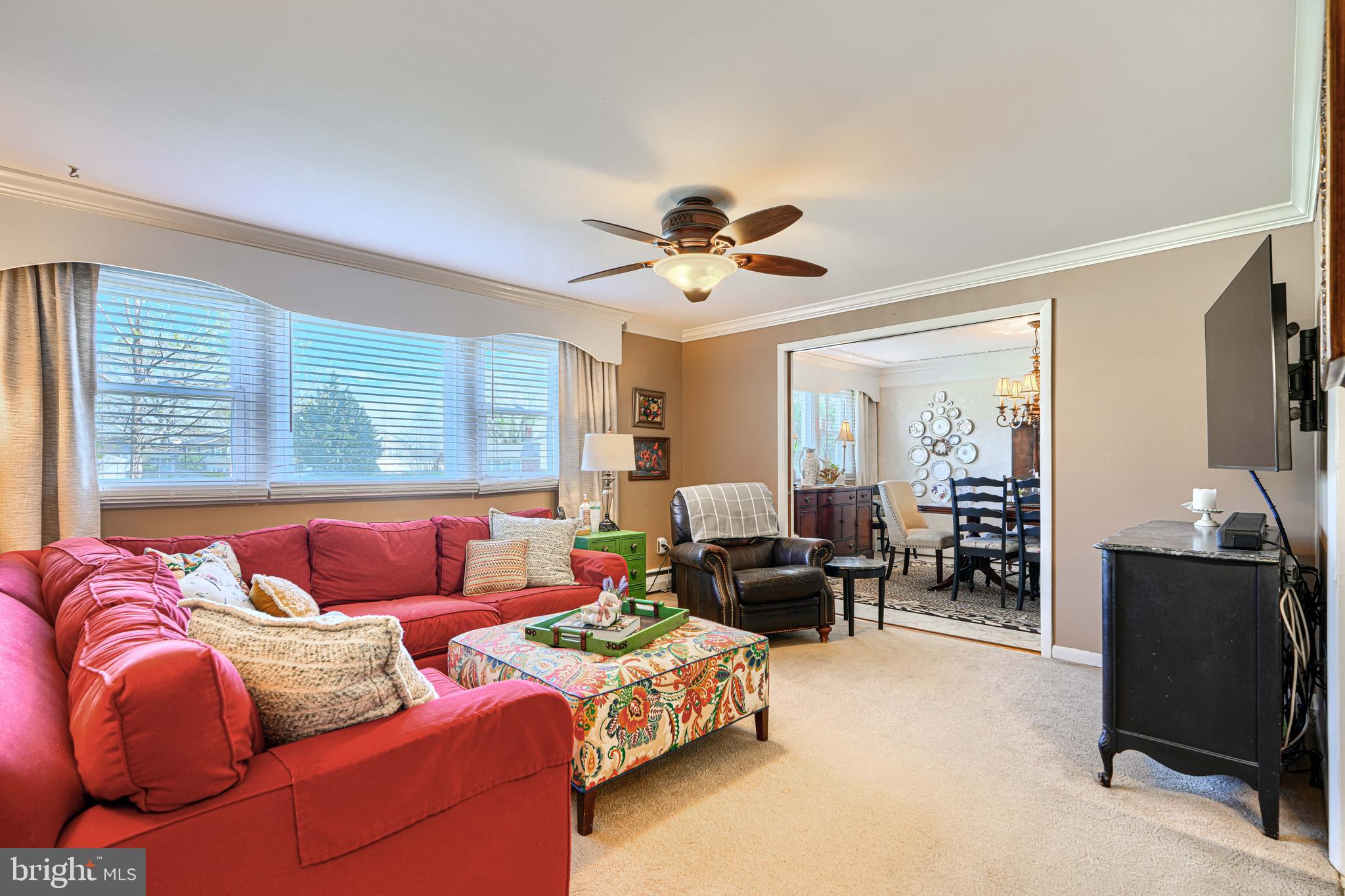 2118 Eastridge Road Lutherville-Timonium, MD 21093 - Photo 8 of 49 a living room with furniture ceiling fan and a window