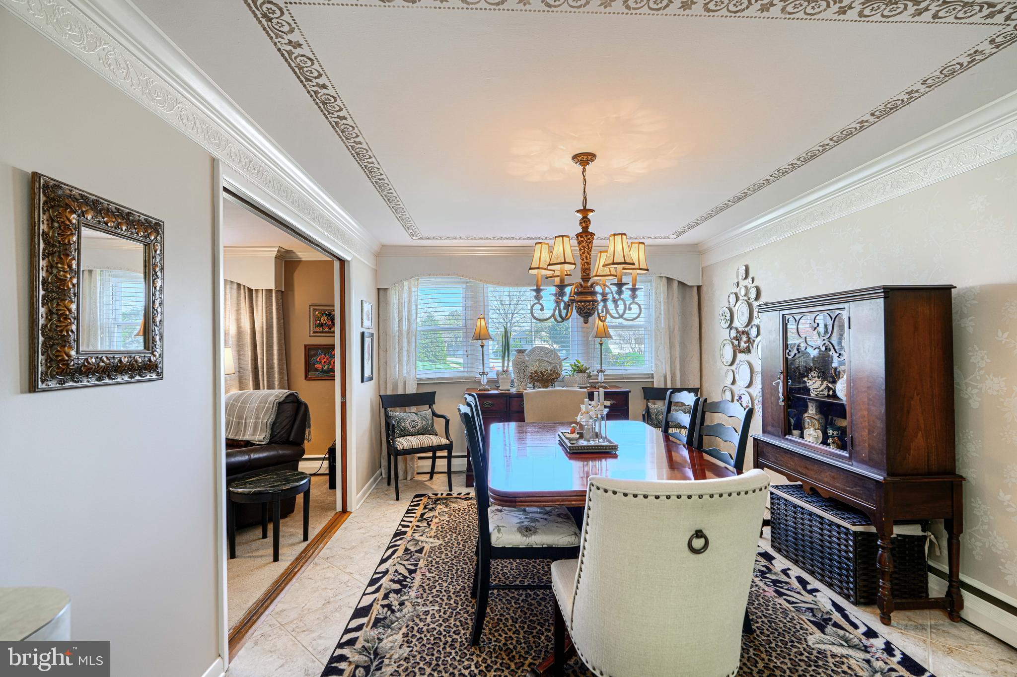 2118 Eastridge Road Lutherville-Timonium, MD 21093 - Photo 10 of 49 a dining room with furniture a chandelier and wooden floor