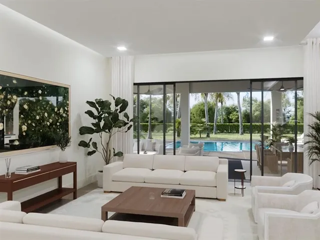 a living room with furniture and large windows