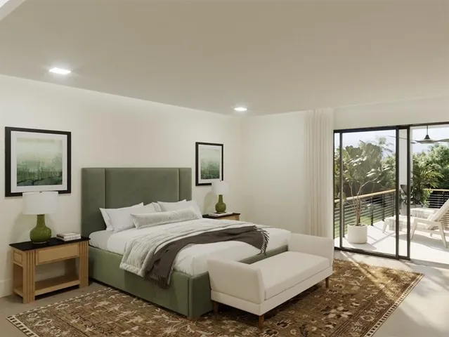 a bedroom with a large bed and a large window