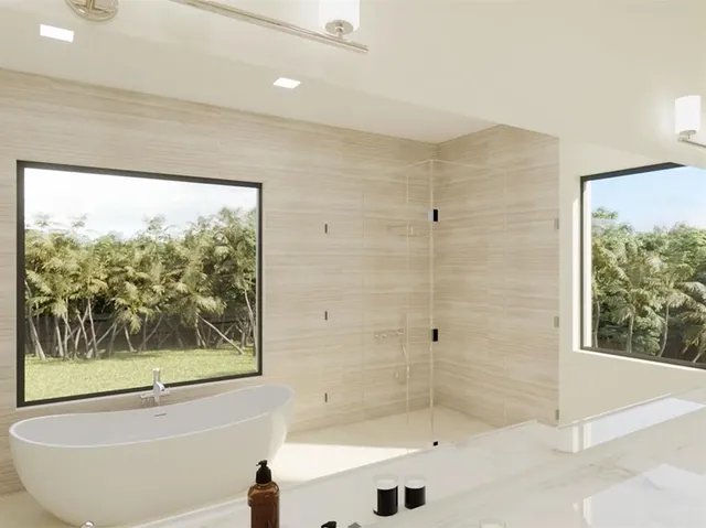 a bathroom with a bathtub and shower