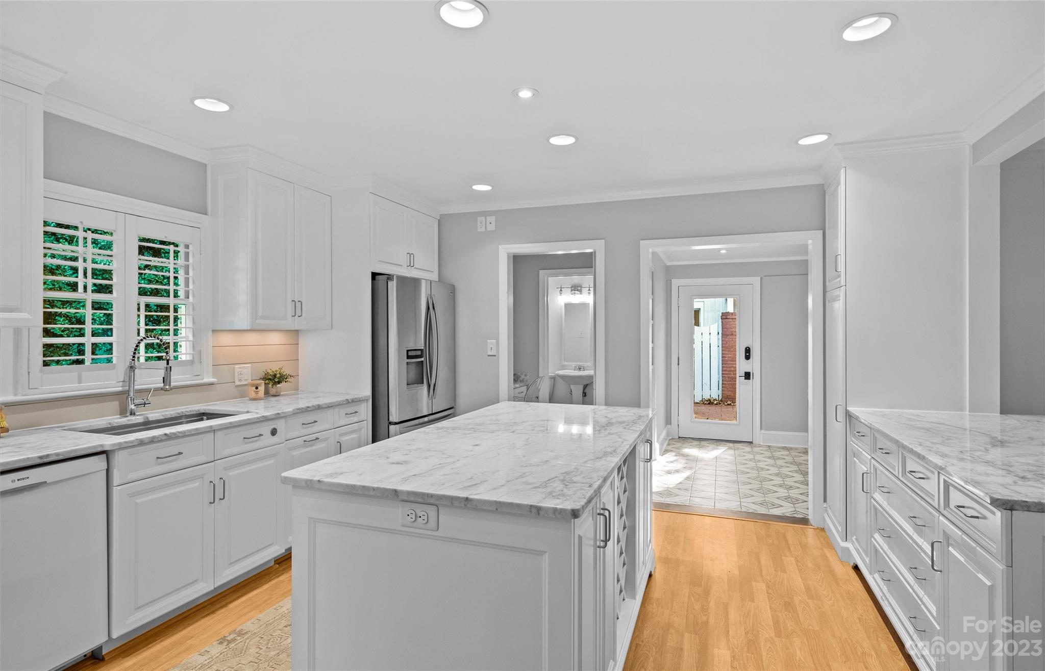 1550 Coventry Road Charlotte, NC 28211 - Photo 14 of 31 a large kitchen with granite countertop a sink and dishwasher with a large window