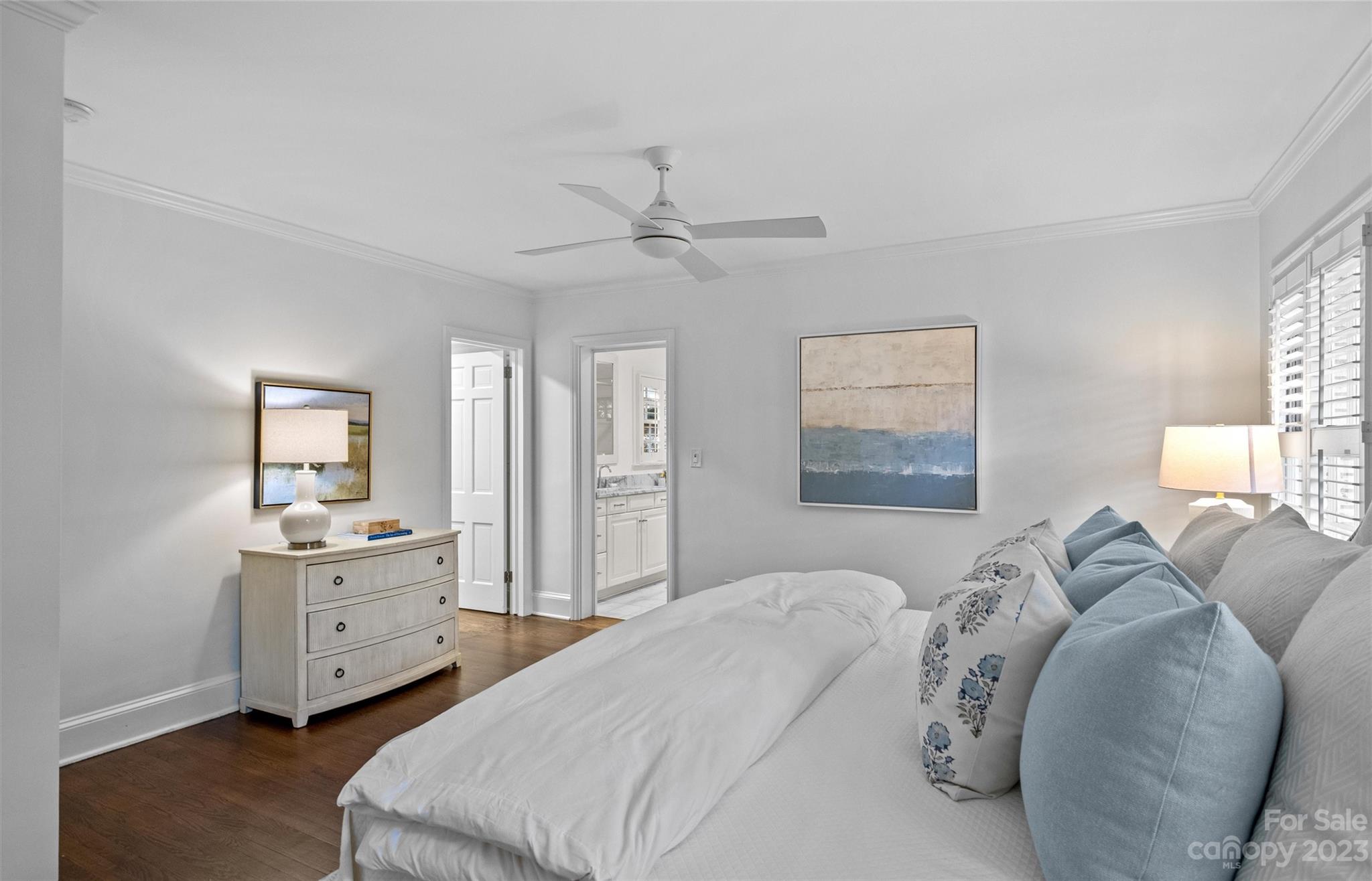 1550 Coventry Road Charlotte, NC 28211 - Photo 19 of 31 a bedroom with a bed and a chandelier