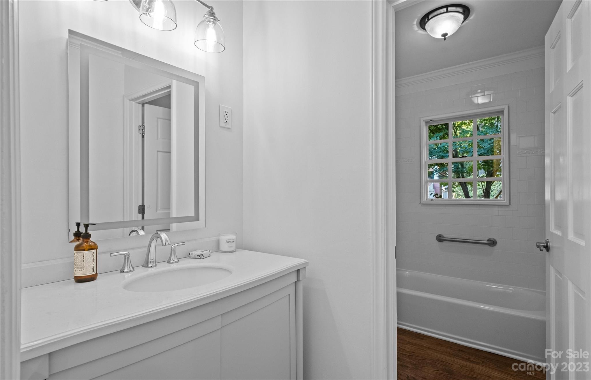 1550 Coventry Road Charlotte, NC 28211 - Photo 23 of 31 a bathroom with a sink and a mirror