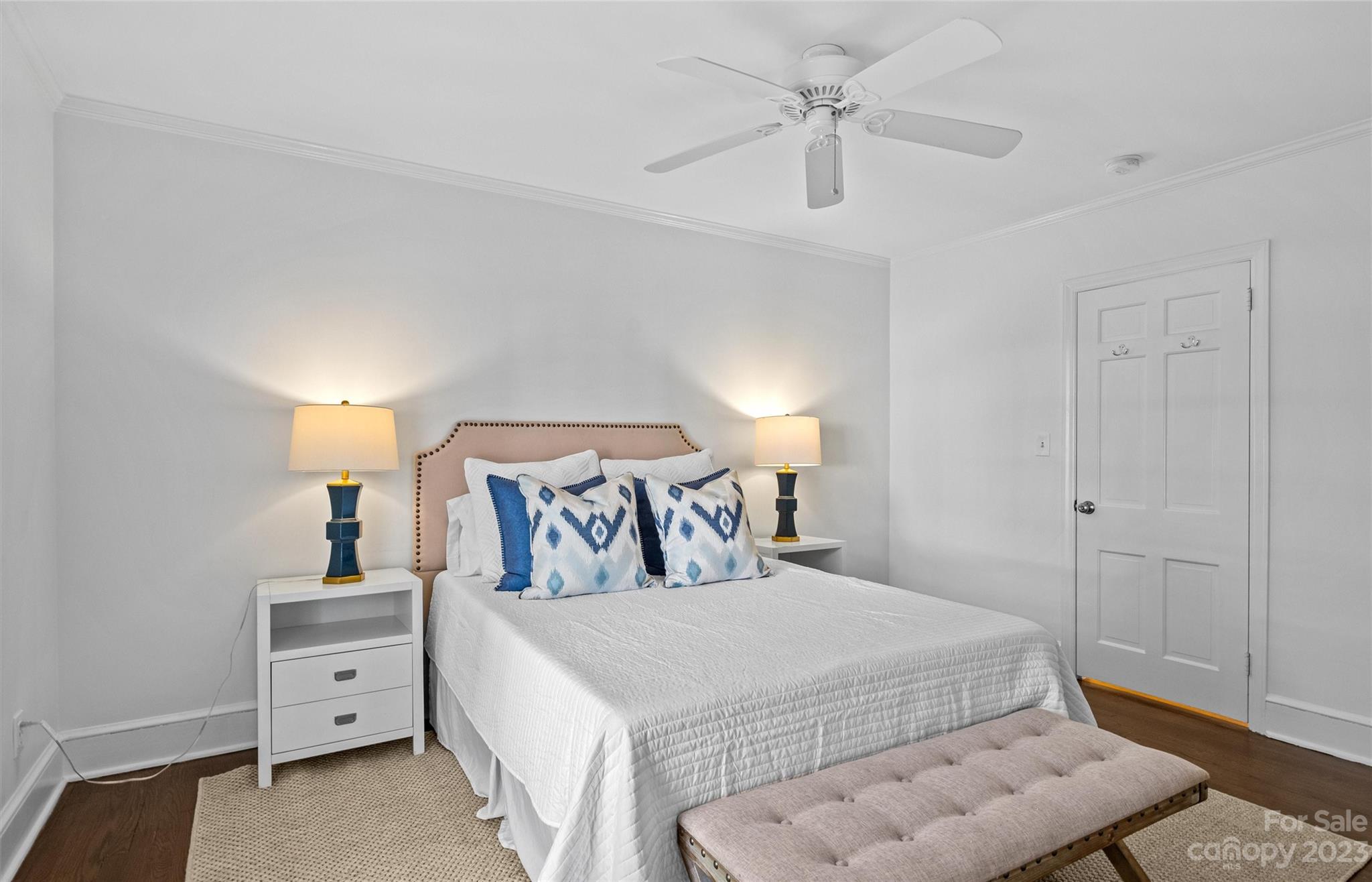 1550 Coventry Road Charlotte, NC 28211 - Photo 24 of 31 a bedroom with a bed and a chandelier