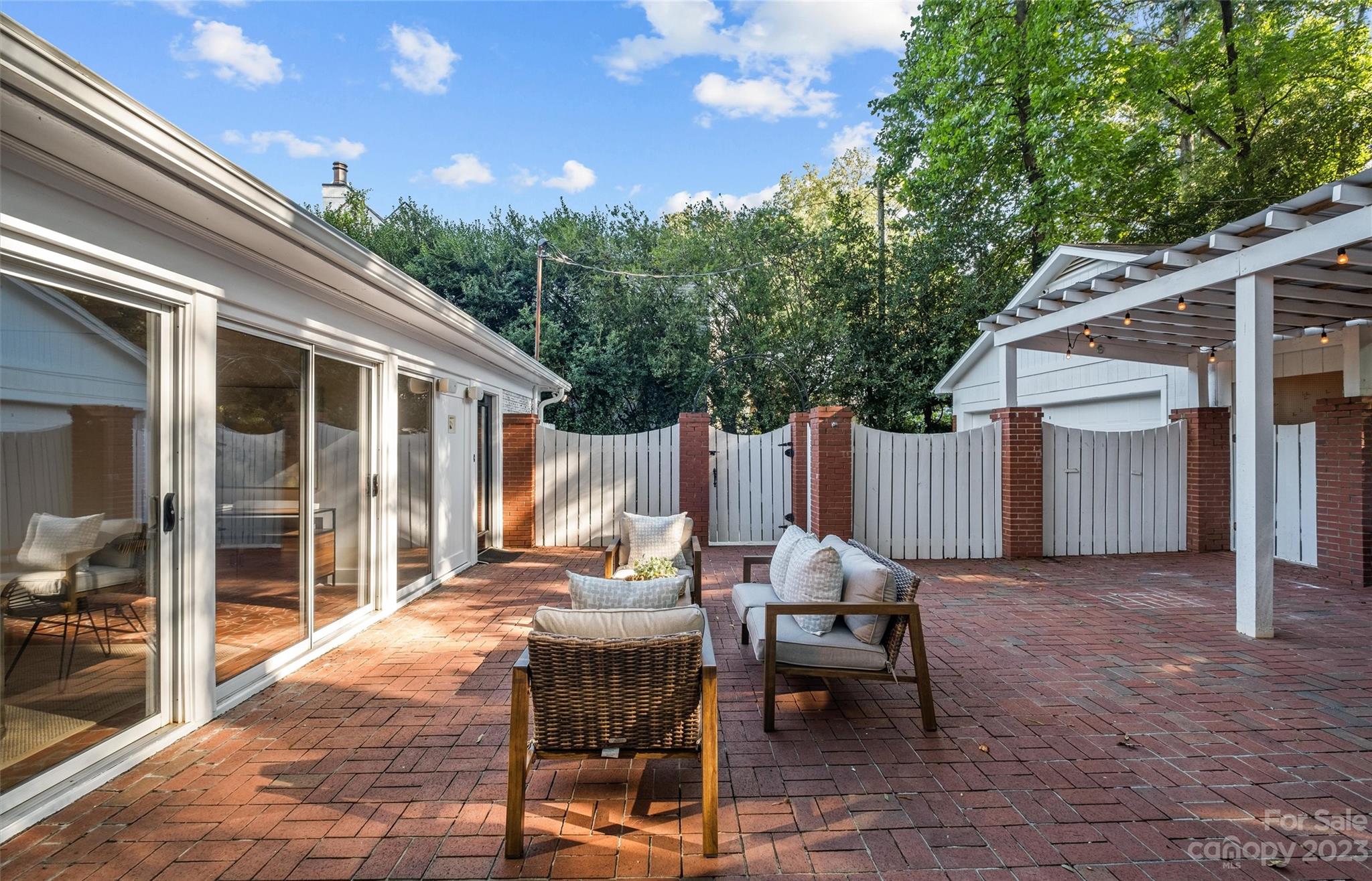 1550 Coventry Road Charlotte, NC 28211 - Photo 27 of 31 a view of a patio with table and chairs and wooden fence