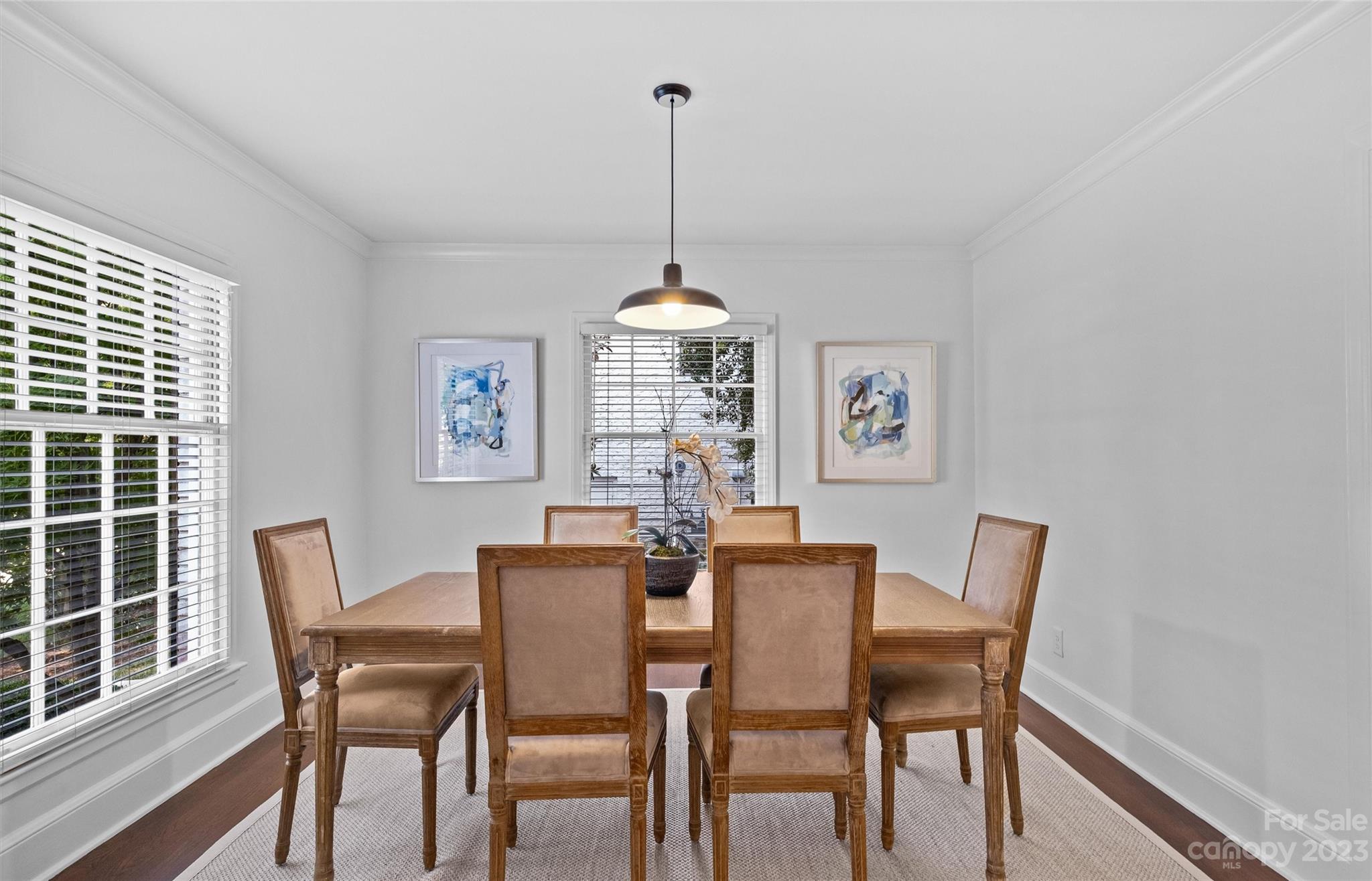 1550 Coventry Road Charlotte, NC 28211 - Photo 5 of 31 a dining room with furniture a chandelier and wooden floor