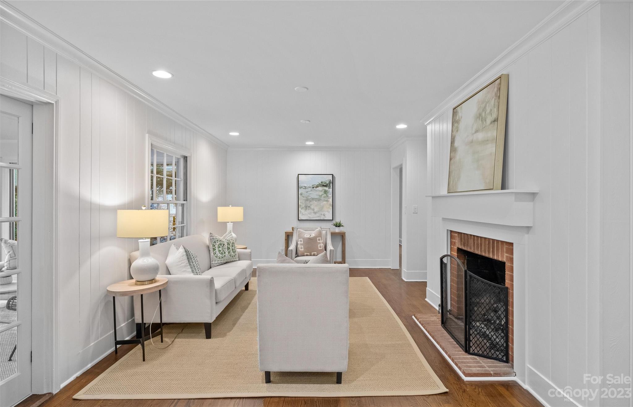 1550 Coventry Road Charlotte, NC 28211 - Photo 7 of 31 a living room with furniture and a fireplace
