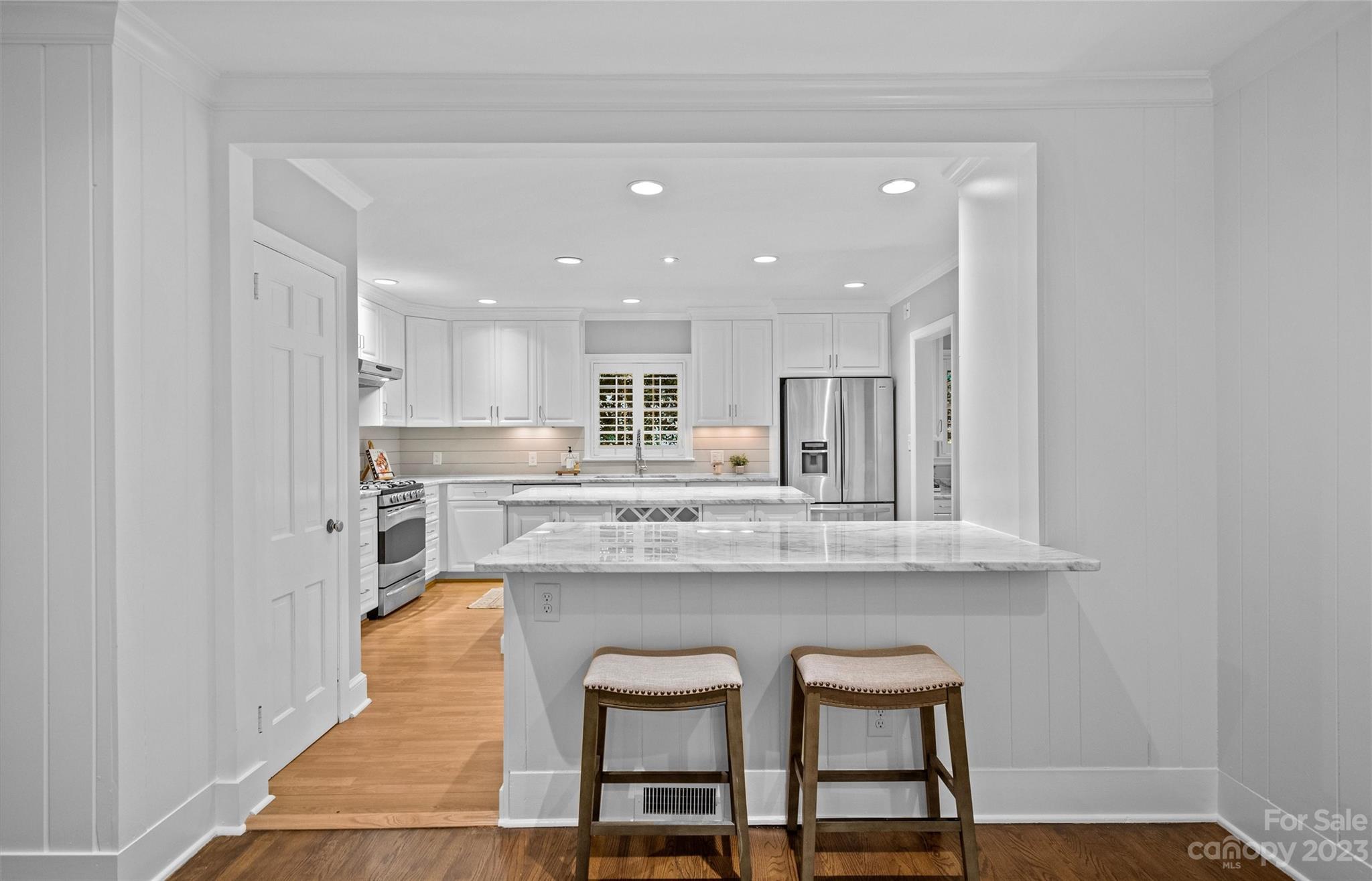 1550 Coventry Road Charlotte, NC 28211 - Photo 8 of 31 a kitchen with kitchen island stainless steel appliances a sink and cabinets