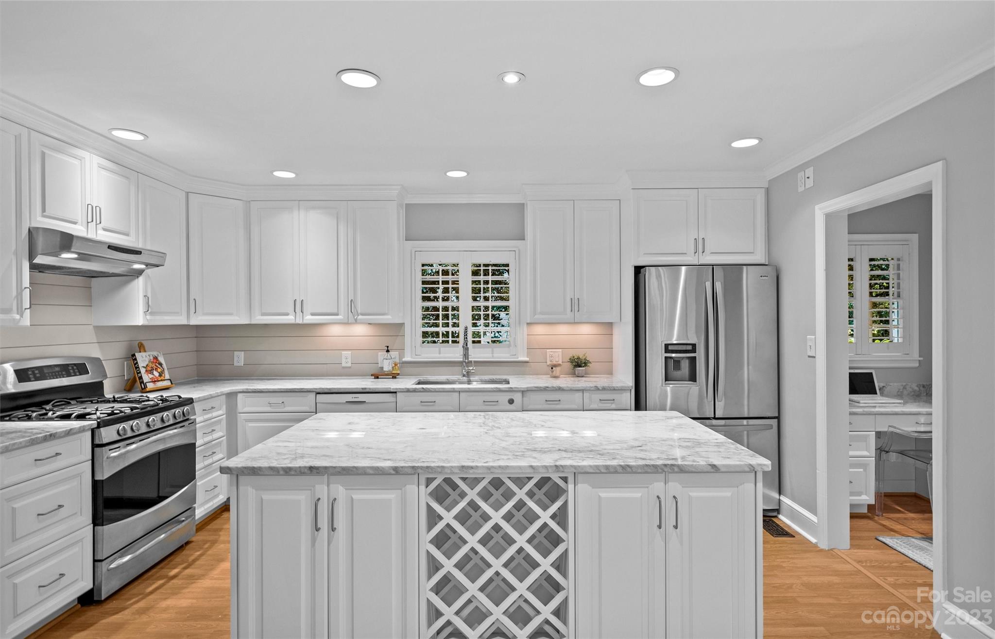 1550 Coventry Road Charlotte, NC 28211 - Photo 9 of 31 a kitchen with stainless steel appliances granite countertop a sink stove and refrigerator