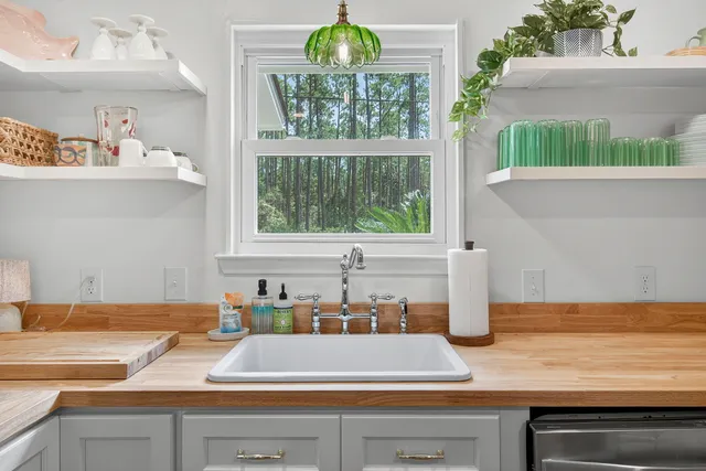 a kitchen with a sink and a window