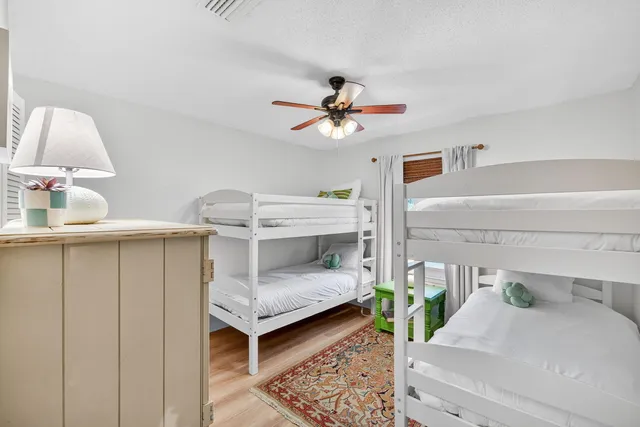 a bedroom with furniture and a chandelier