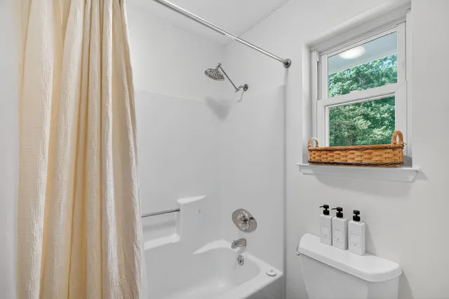 a bathroom with a sink a toilet and a bathtub