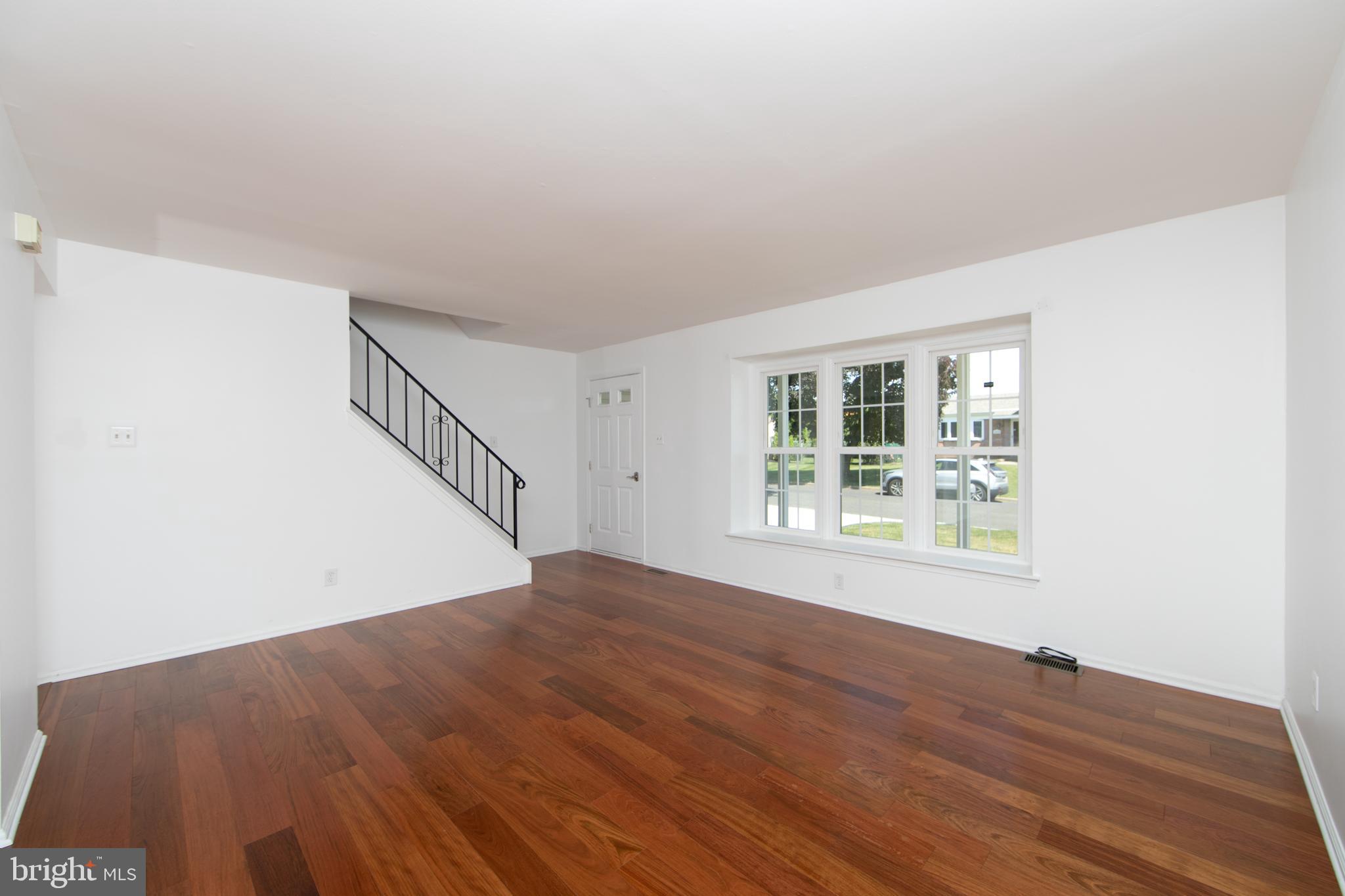 3007 Rampart Road Bensalem, PA 19020 - Photo 9 of 48 a view of an empty room with wooden floor and a window