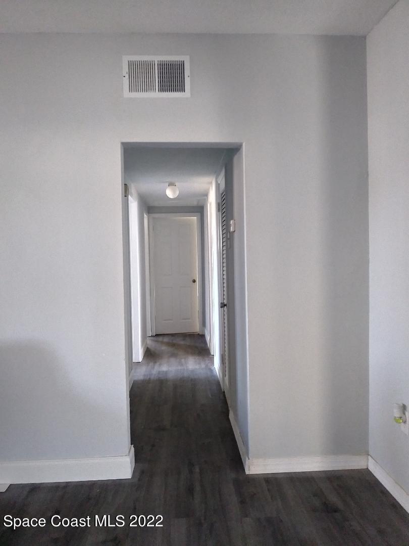 905 Avon Place Cocoa, FL 32922 - Photo 2 of 2 a view of a hallway with wooden floor