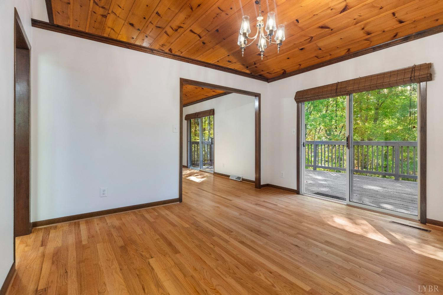 594 Viewmont Drive Evington, VA 24550 - Photo 12 of 43 a view of empty room with wooden floor and fan