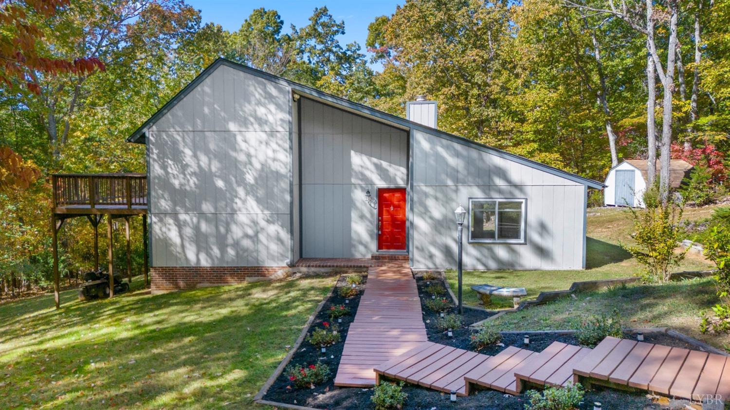 594 Viewmont Drive Evington, VA 24550 - Photo 2 of 43 a backyard of a house with lots of green space