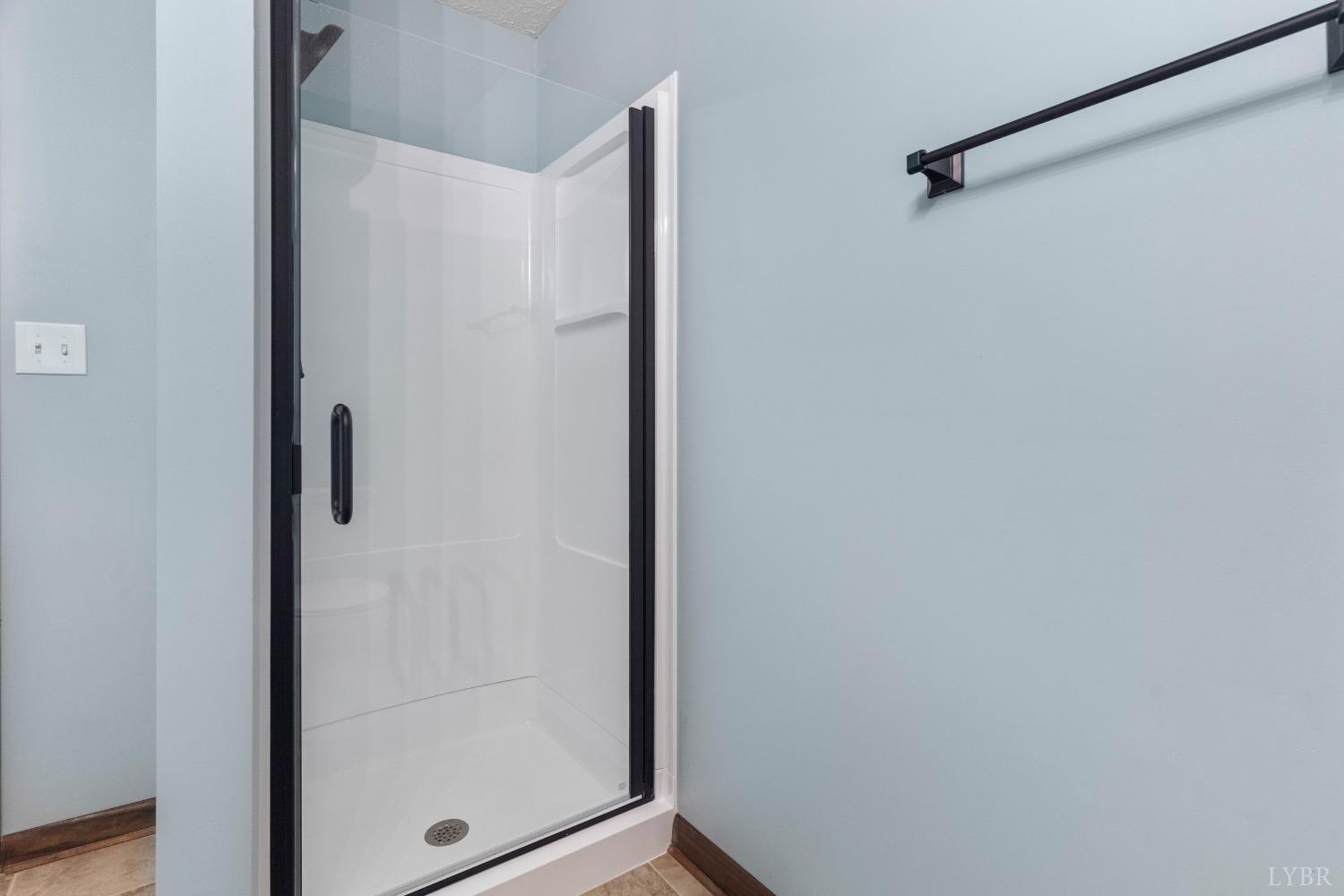 594 Viewmont Drive Evington, VA 24550 - Photo 9 of 43 a bathroom with a glass shower door