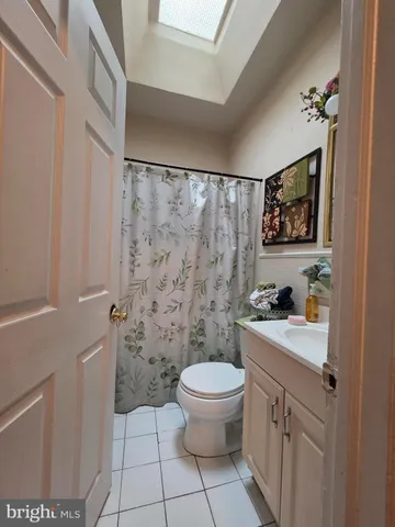 a bed room with a bed and a television