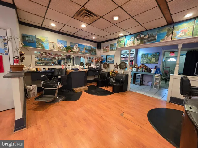 a room with lots of furniture and air hockey table