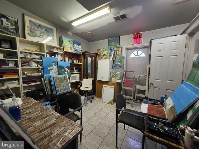 a room with a sink and mirror