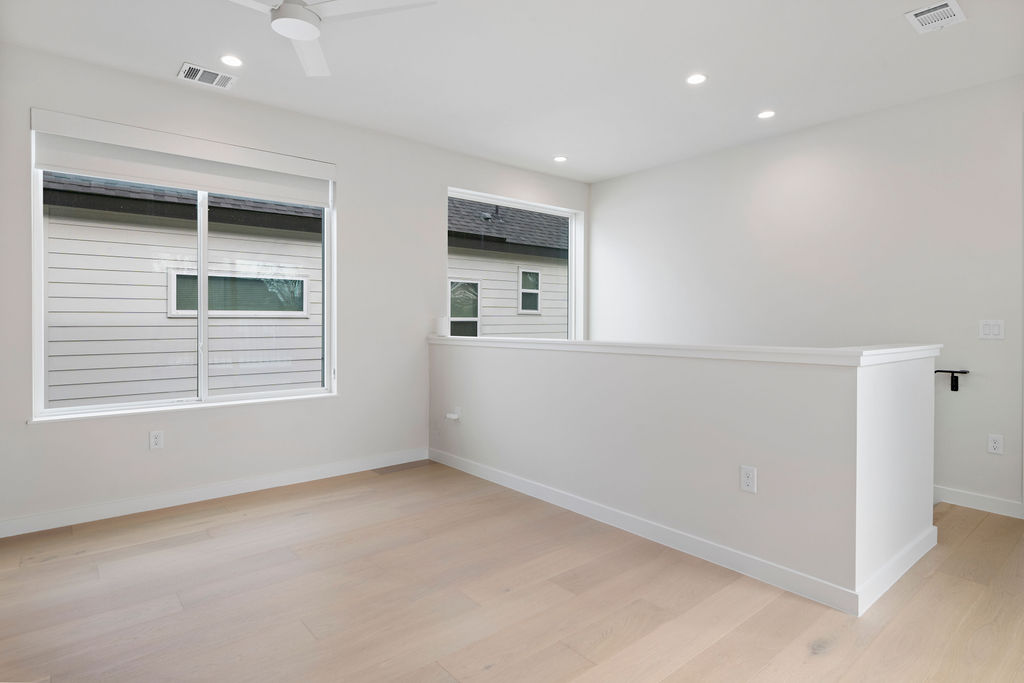 2912 East 13th Street Austin, TX 78702 - Photo 20 of 40 a view of an empty room with a window