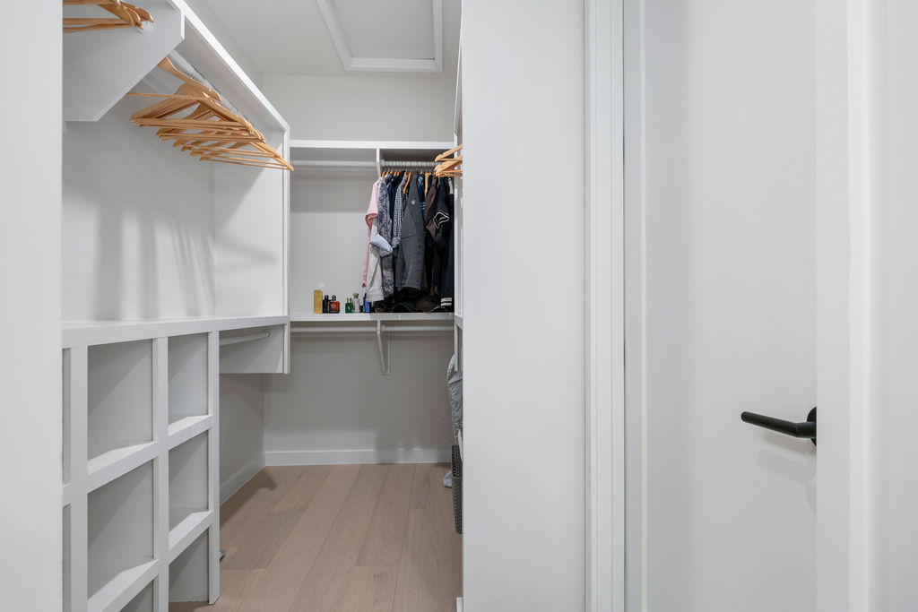 2912 East 13th Street Austin, TX 78702 - Photo 27 of 40 a view of walk in closet with clothes