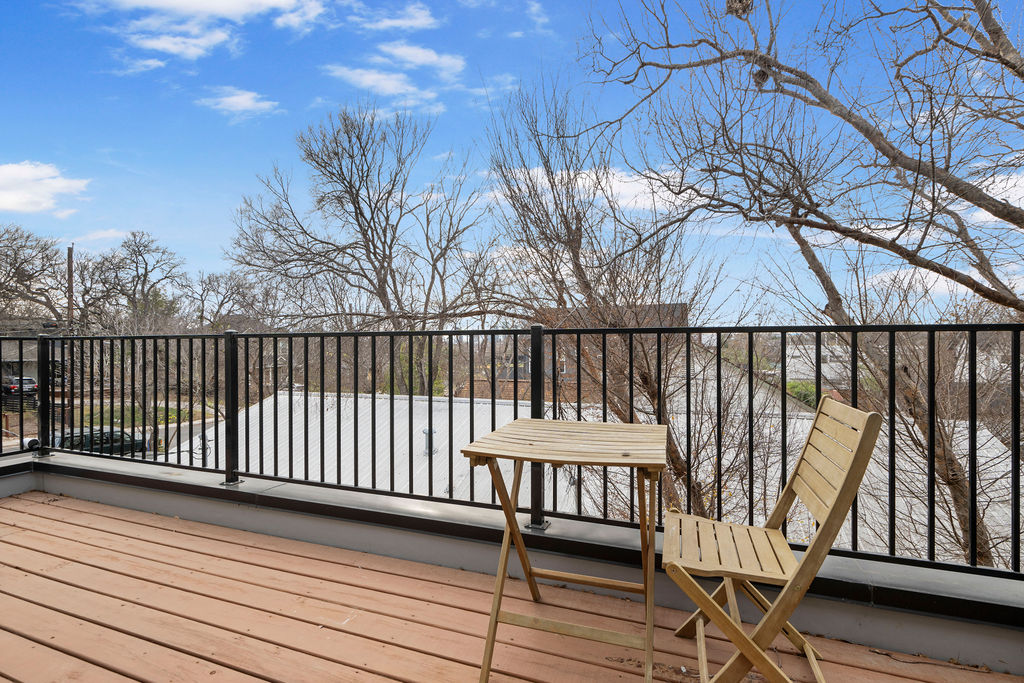 2912 East 13th Street Austin, TX 78702 - Photo 34 of 40 a view of balcony with wooden floor and fence