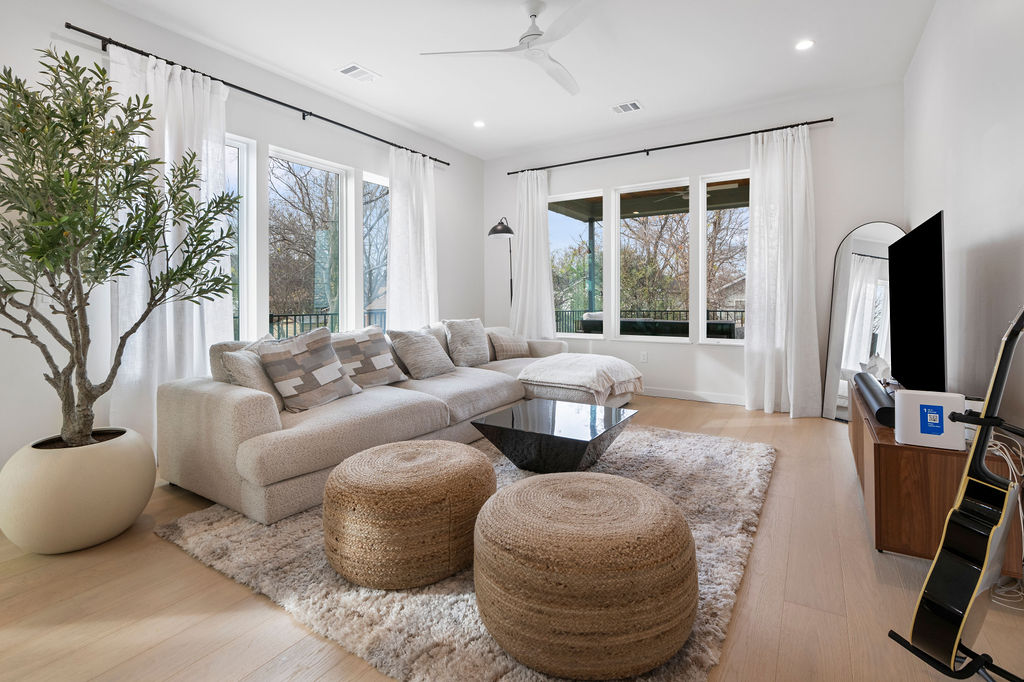 2912 East 13th Street Austin, TX 78702 - Photo 5 of 40 a living room with furniture and a flat screen tv