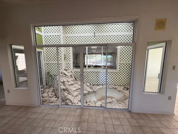 a bathroom with a sink a toilet a mirror and shower