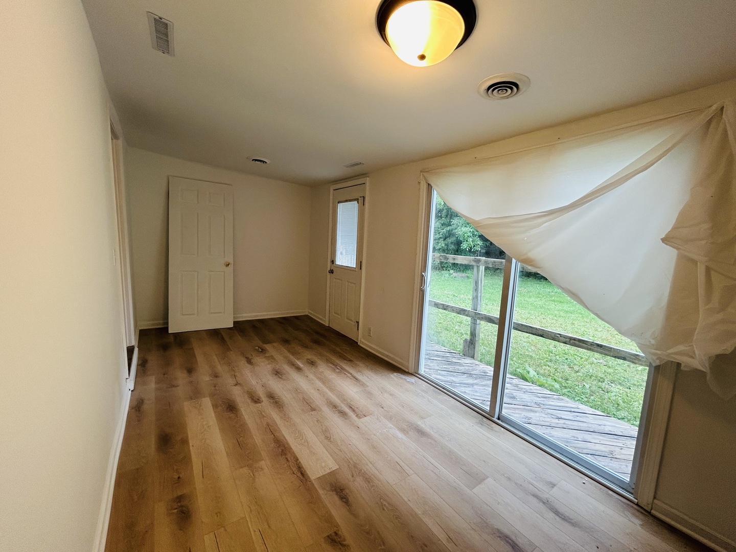 37706 North Nippersink Place Spring Grove, IL 60081 - Photo 11 of 18 a view of a room with wooden floor and window