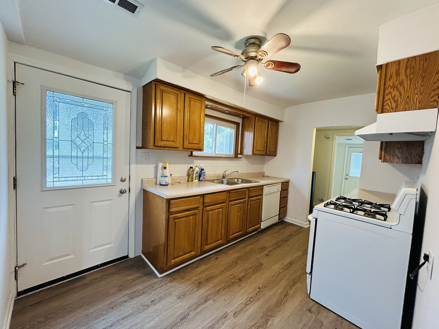 37706 North Nippersink Place Spring Grove, IL 60081 - Photo 3 of 18 a kitchen with stainless steel appliances granite countertop a stove a sink dishwasher and a refrigerator