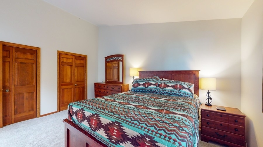 43375 Hunt Club Road Zion, IL 60099 - Photo 11 of 56 a bedroom with a bed and a closet