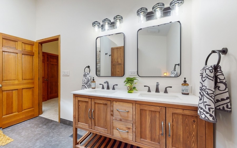 43375 Hunt Club Road Zion, IL 60099 - Photo 13 of 56 a bathroom with a double vanity sink and a mirror