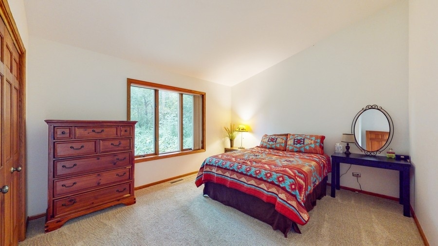 43375 Hunt Club Road Zion, IL 60099 - Photo 14 of 56 a bedroom with a bed and a dresser