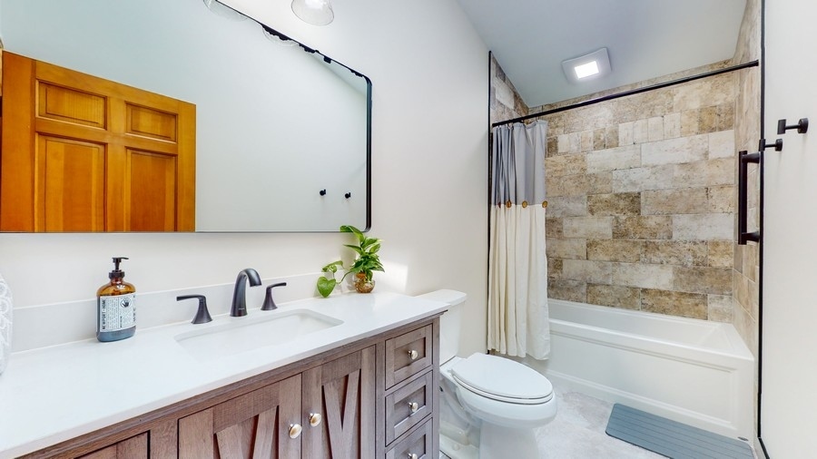 43375 Hunt Club Road Zion, IL 60099 - Photo 15 of 56 a bathroom with a sink a toilet and shower