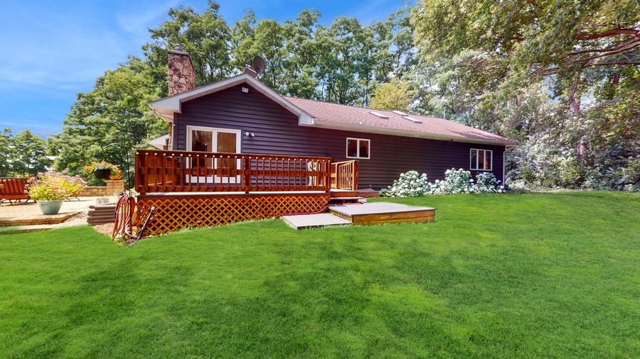 43375 Hunt Club Road Zion, IL 60099 - Photo 19 of 56 a front view of a house with garden